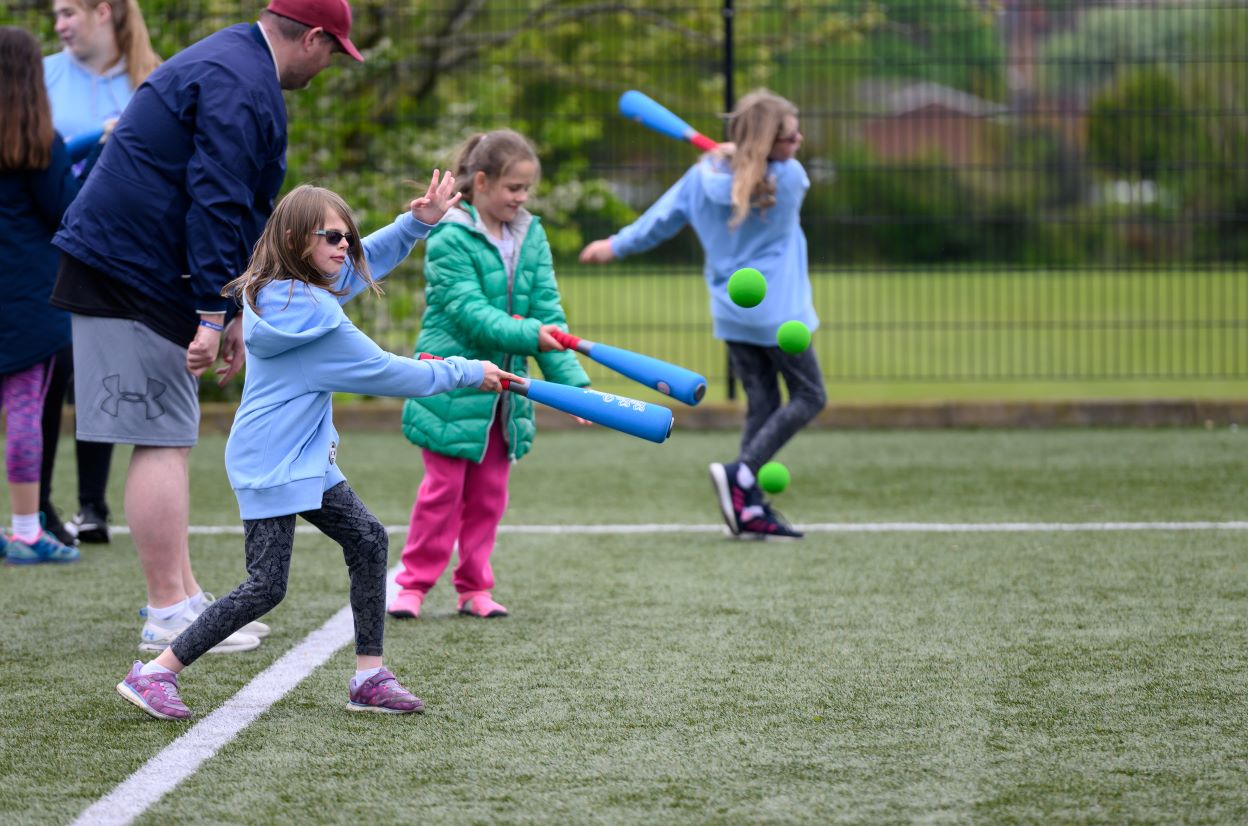 Children with a rounders bat