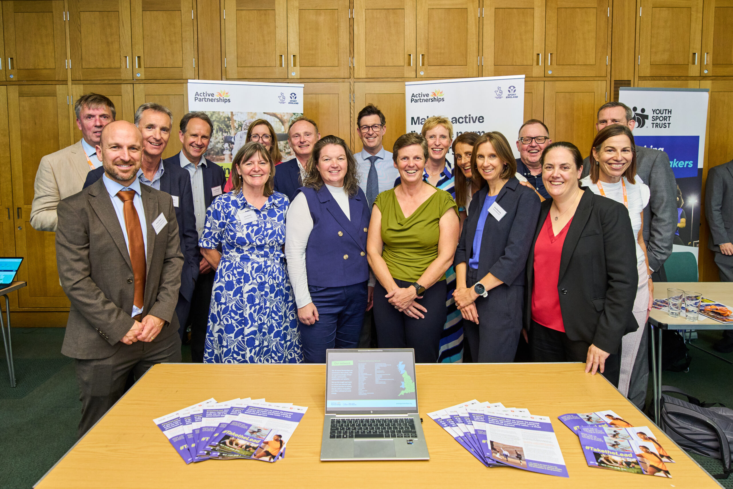 A group photo of representatives from the Active Partnerships network at an NSPG reception in parliament.